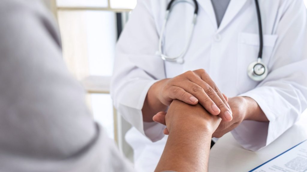 a doctor helping a patient with codeine withdrawal symptoms